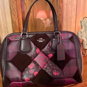 A beautiful patchwork coach bag.